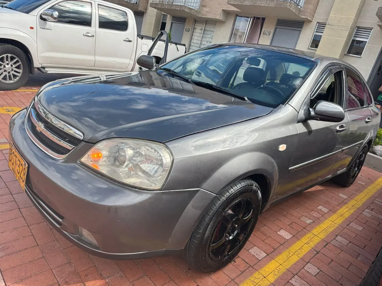 Sedã Chevrolet Optra 2006 en Ibagué — foto 16