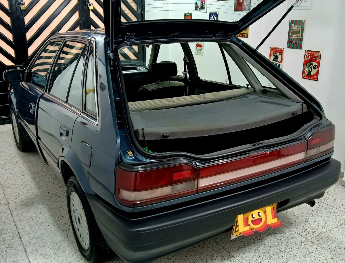 Mazda 323 1997 Verde Bogotá